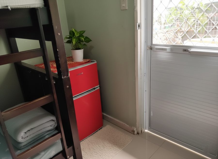 A mini refrigerator inside the room.